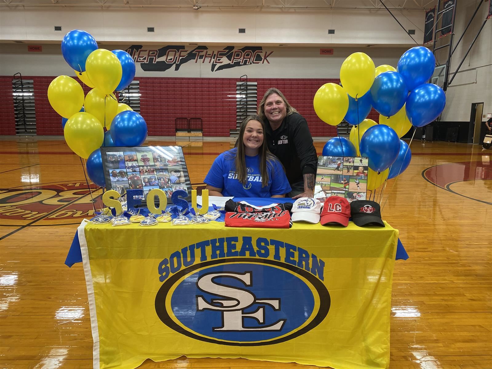 Langham Creek senior Emily Simmons, seated, signed a letter of intent to Southeastern Oklahoma State University.